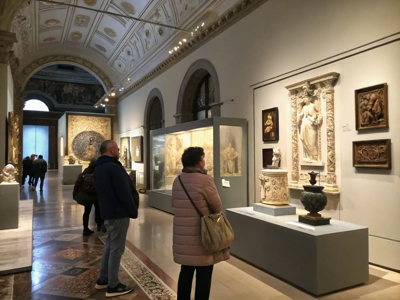A museum guide leading a group of visitors on a guided tour through the exhibits at MUSEE D'HIER & D'AVANT-HIER DE SAINT-ANDRE DE LIDON, explaining the historical significance of the artifacts.
